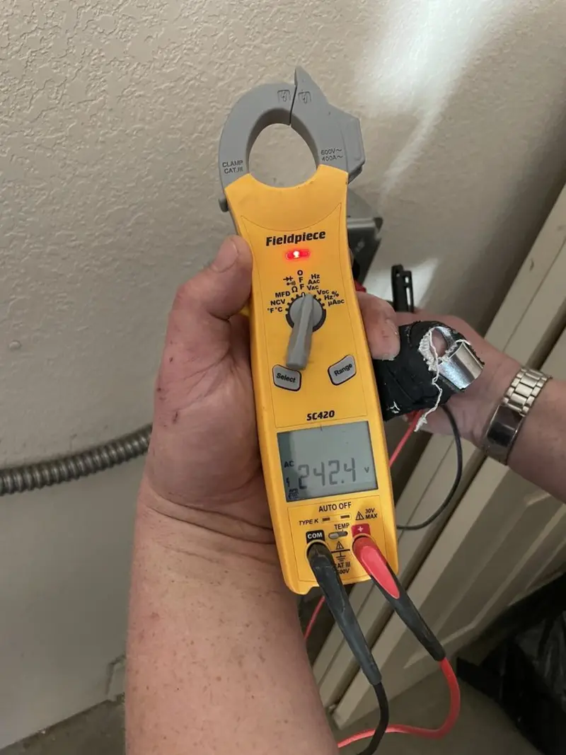 Voltage testing with clamp meter during Ceiling Fan Installation in Summerside
